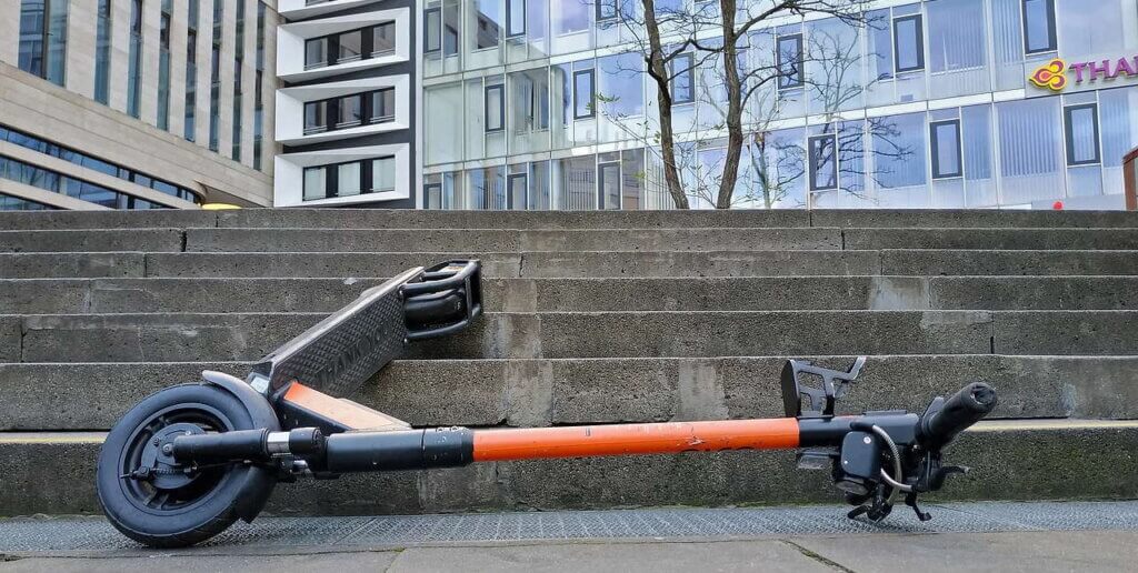 electric scooter laying on street