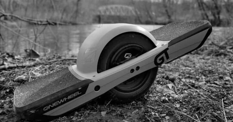 Onewheel GT in front for bridge and river
