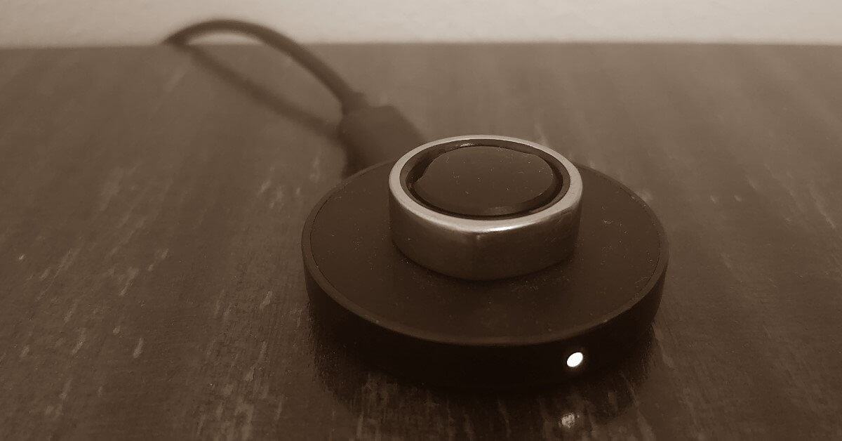 Oura Ring Charging on wood table