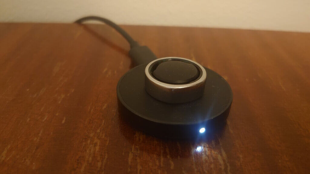 Oura Ring charging on a table